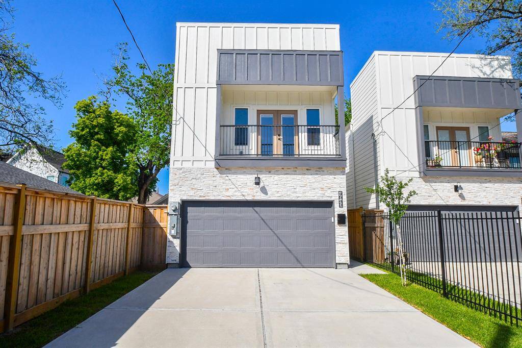 You'll love the classic look of this two-story home, complete with a charming second-floor balcony off the primary bedroom.
