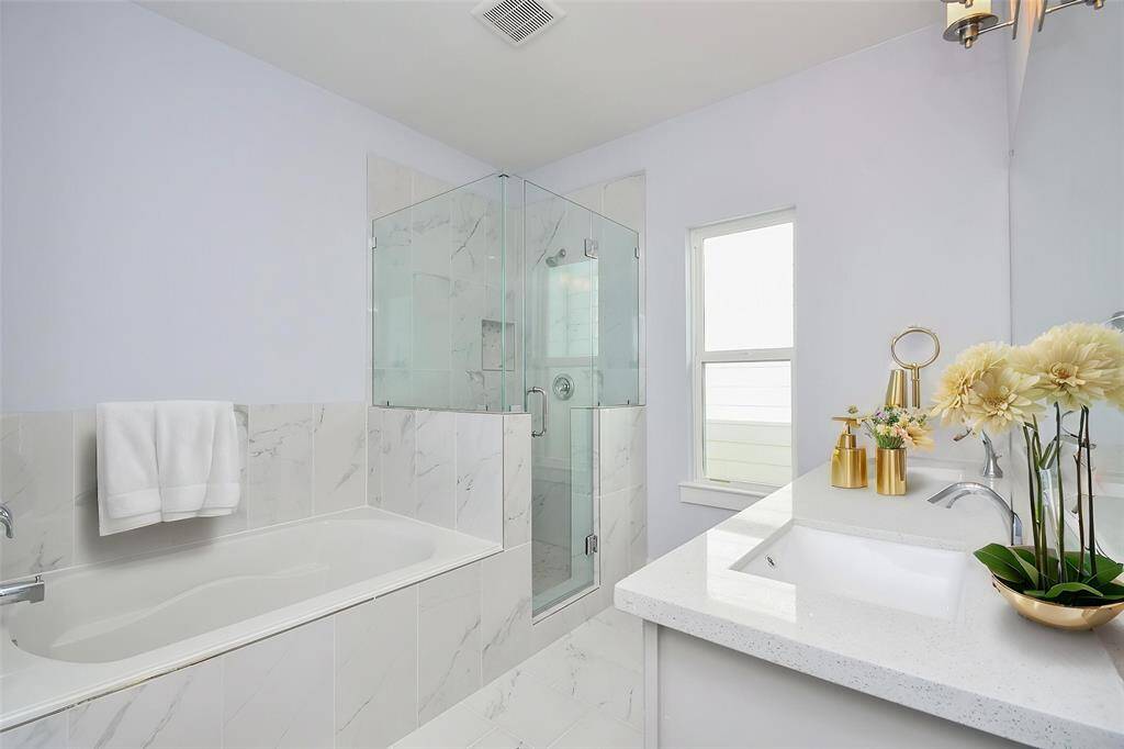 This primary bath sanctuary offers the perfect retreat for relaxation after a long workday.