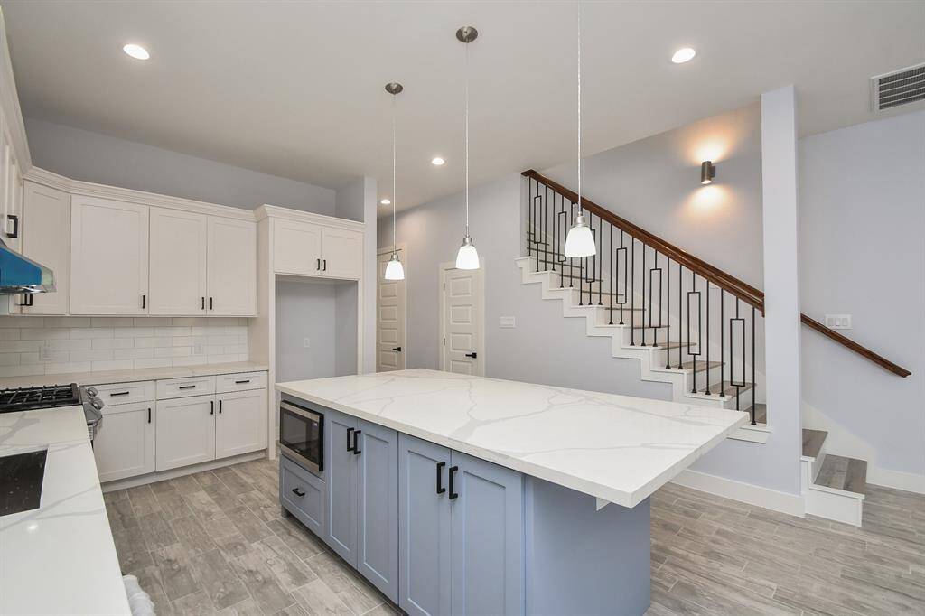 Upon entering this beautiful home, you'll be greeted by a spacious kitchen, with the comfortable bedrooms located upstairs for ultimate convenience.
