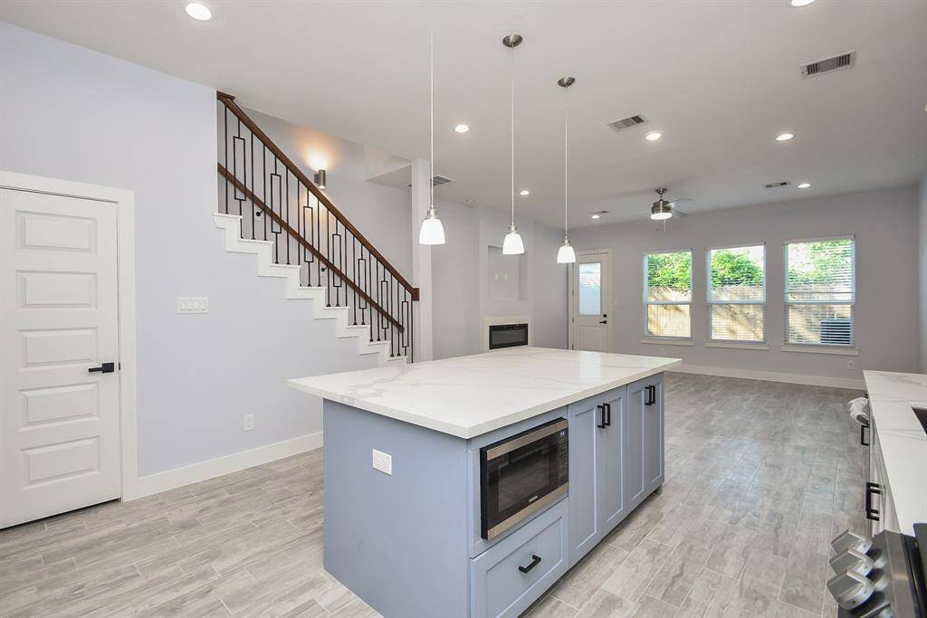 Notice how the kitchen seamlessly flows into the family room, creating a warm and inviting open space on the first level.