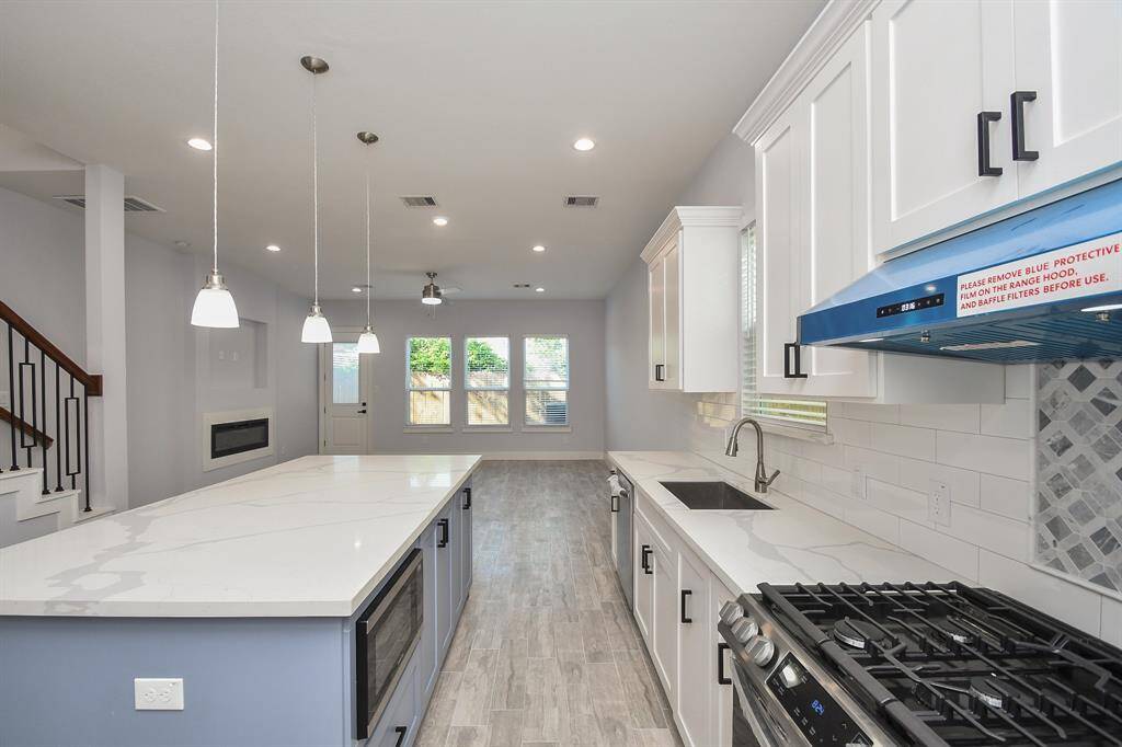 Spacious and open, the kitchen effortlessly flows into the family room, creating a perfect gathering space.