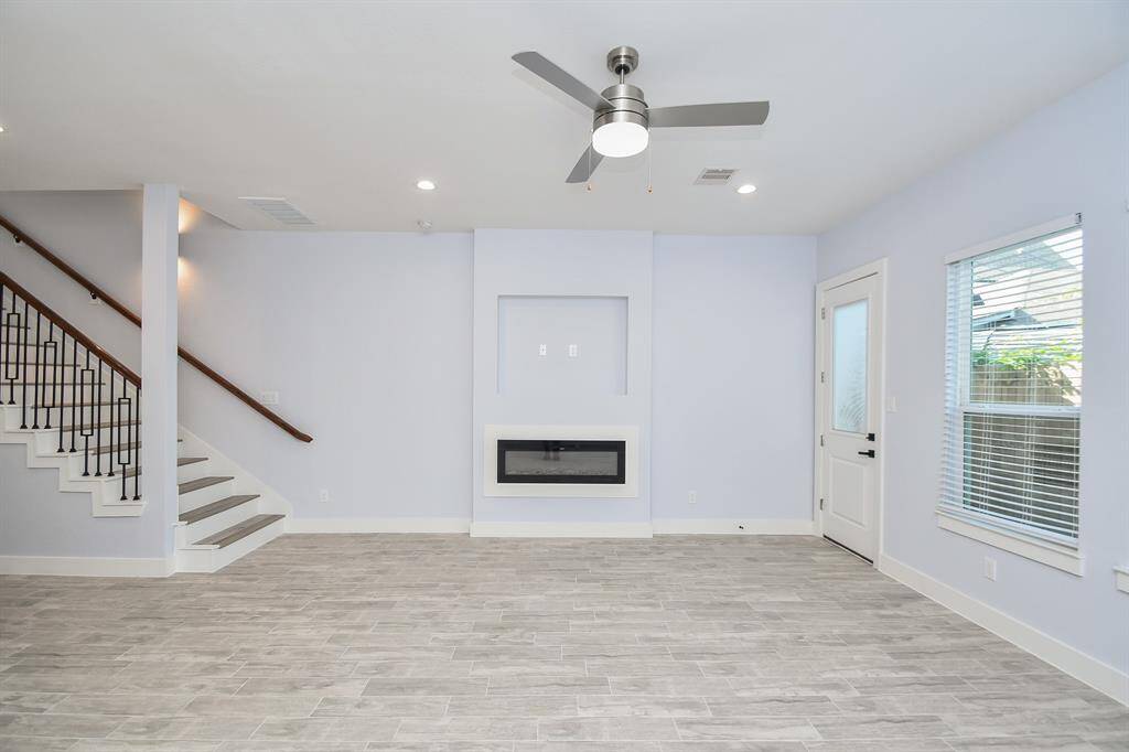 The fireplace serves as the central focal point of your downstairs living space, creating a cozy and inviting atmosphere.