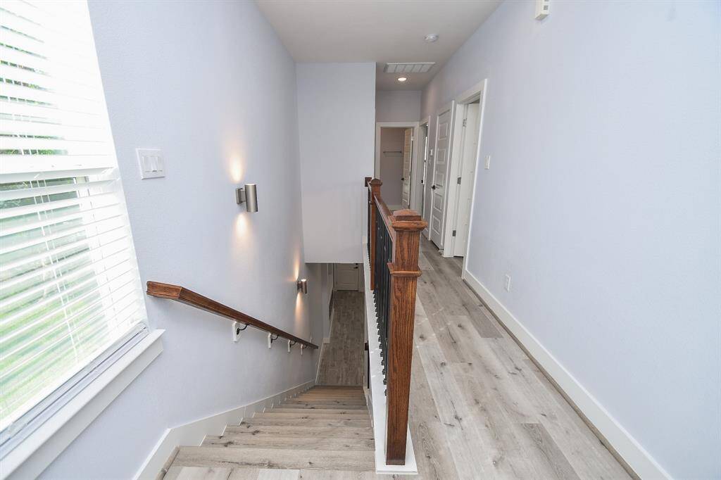 A trip up the stairs leads to the bedroom and bathroom areas, offering a private and comfortable retreat.