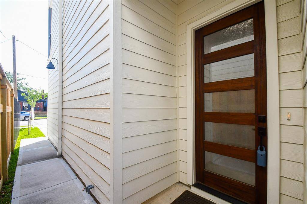 Tucked away for added privacy, your beautiful front door sits just steps from the spacious double driveway.