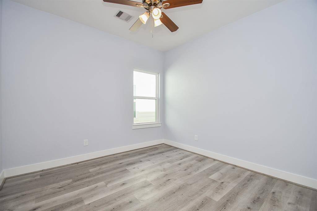 Each of the secondary bedrooms offers the same beautiful flooring found throughout the home, along with large windows that bring in plenty of natural light.
