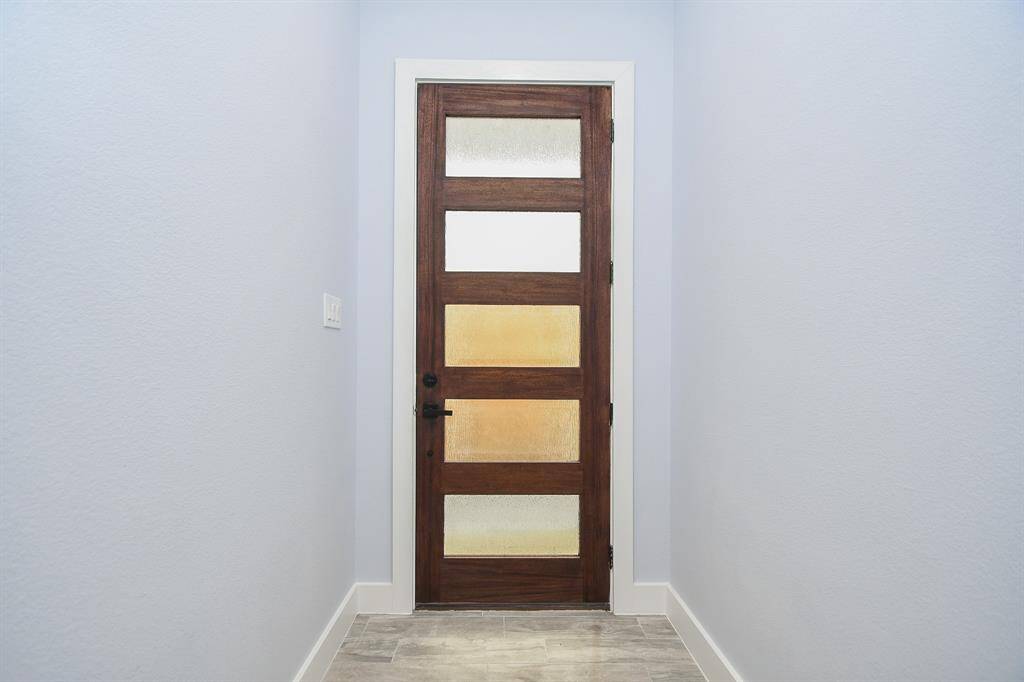 The tall 10-foot ceilings and striking entry door make a memorable first impression for friends and family who come to visit.