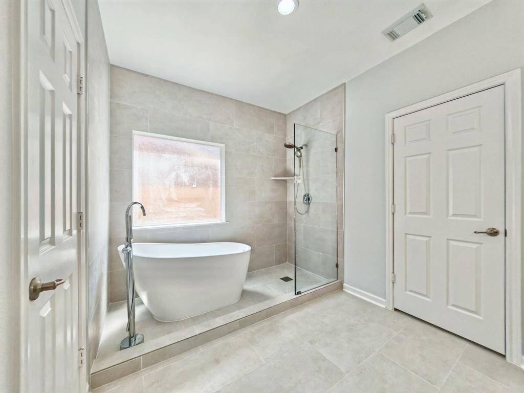 Stylish freestanding soaking tub and a separate walk-in shower