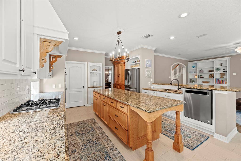 Granite countertops paired with a coordinating backsplash not only provide a durable and elegant surface for food preparation but also add a touch of luxury and sophistication to the kitchen.