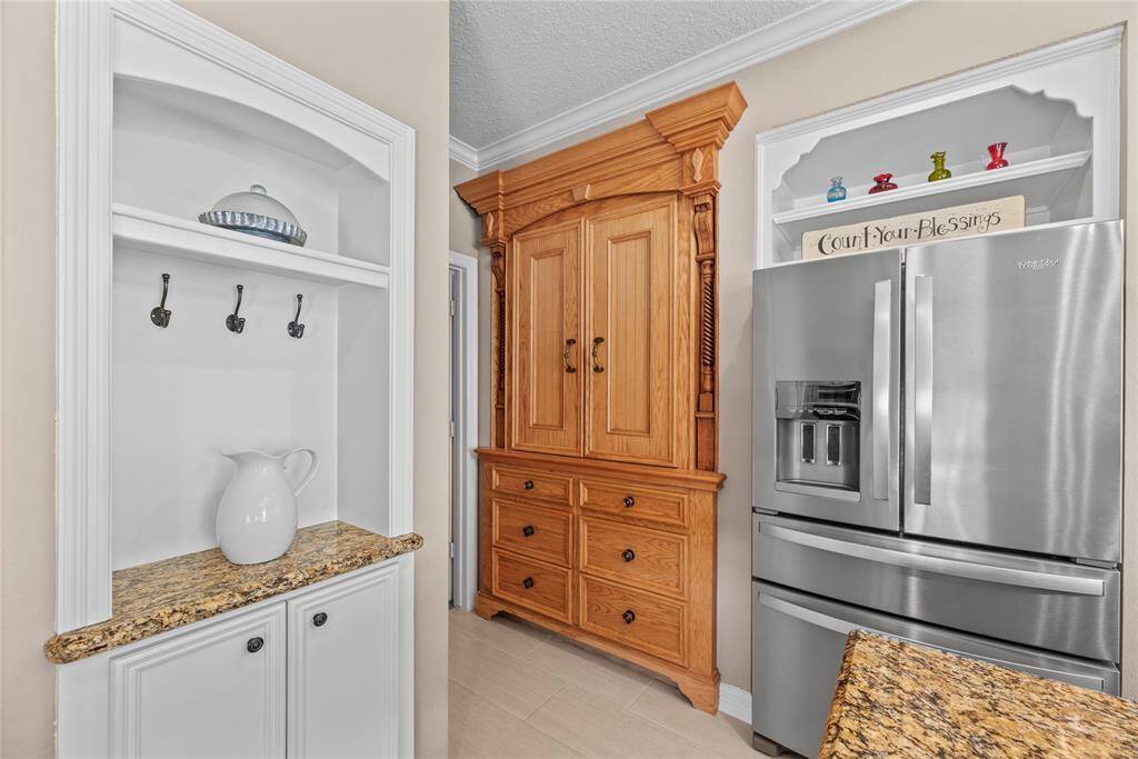 The pantry is a custom piece that looks like furniture allowing for the continuation of character throughout the home.