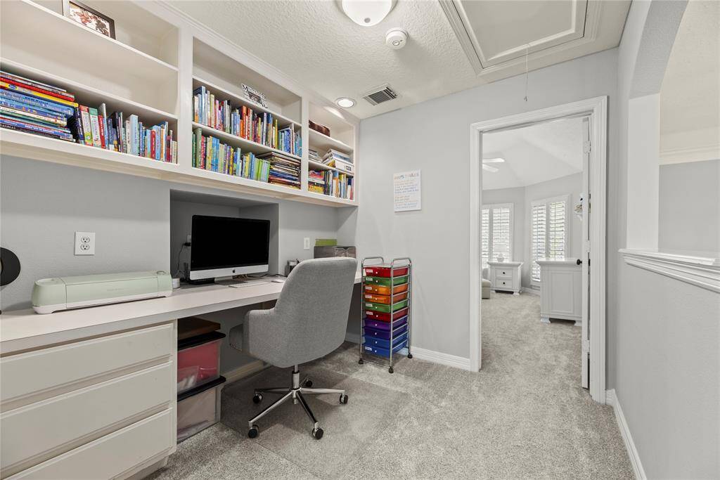 This cozy study nook is designed for productivity, featuring ample storage and a comfortable setup to keep your ideas flowing.