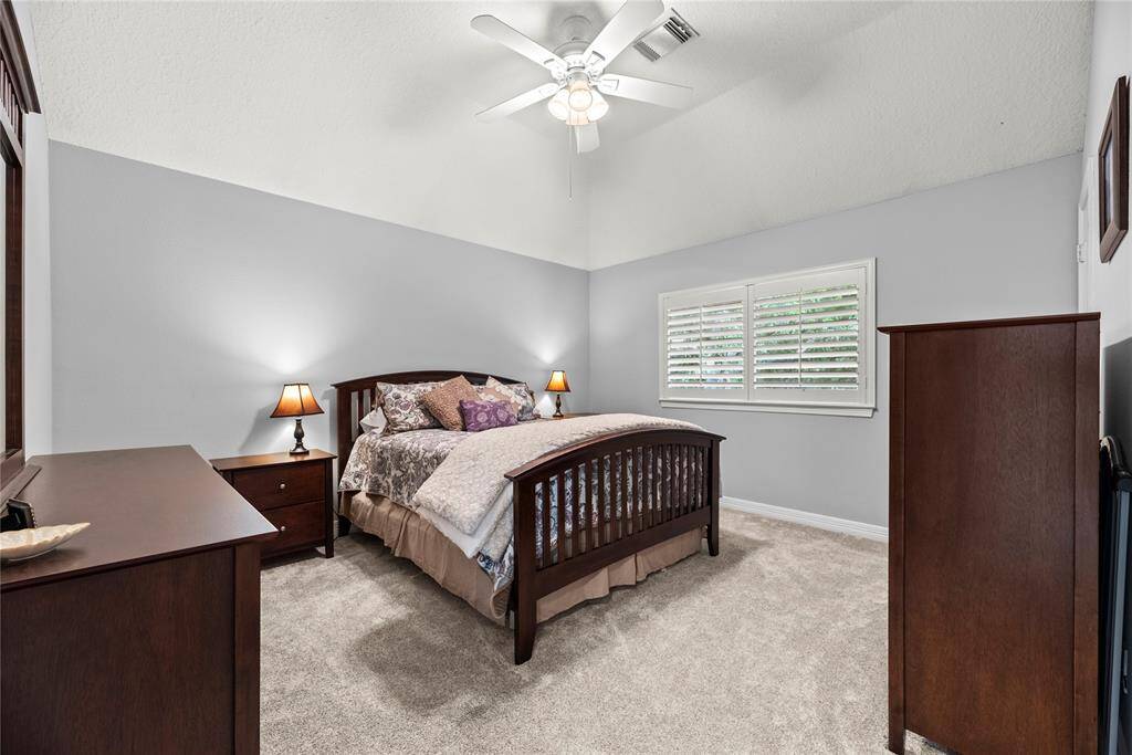 Large secondary bedroom with fan, walk in closet, and private bath!