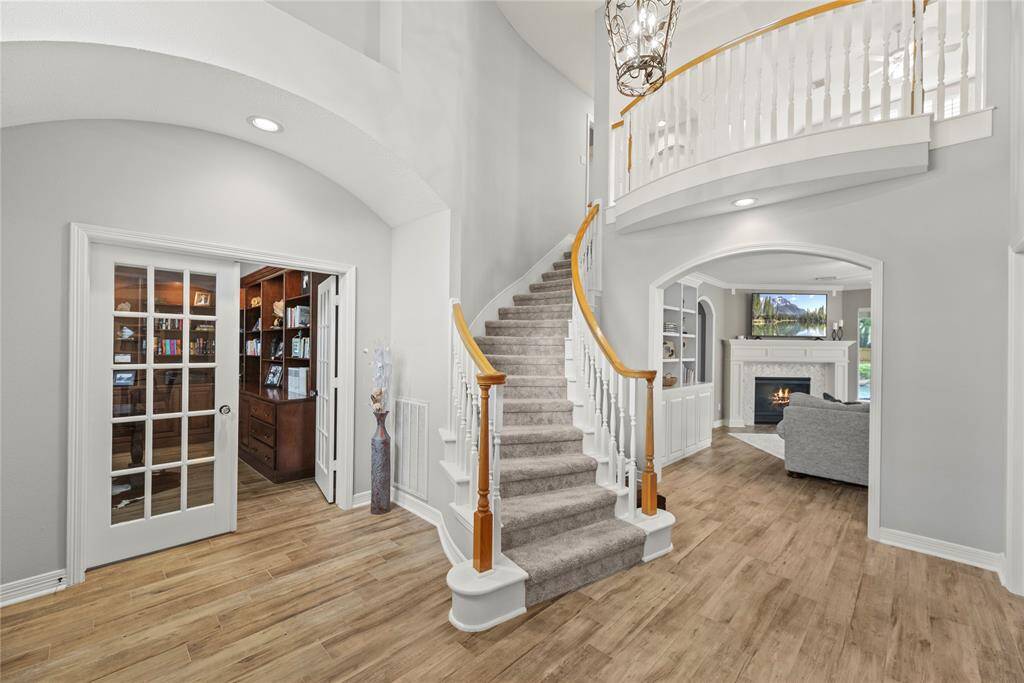 Tucked behind elegant double glass doors, the private study offers both sophistication and seclusion, featuring two walls of beautifully crafted built-ins—perfect for books, décor, or cherished keepsakes.