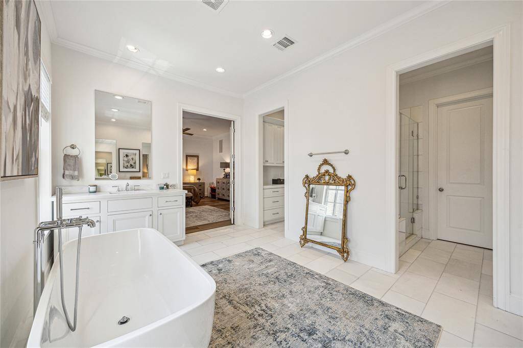 A view showing the dual openings that lead to the shower and double closets.