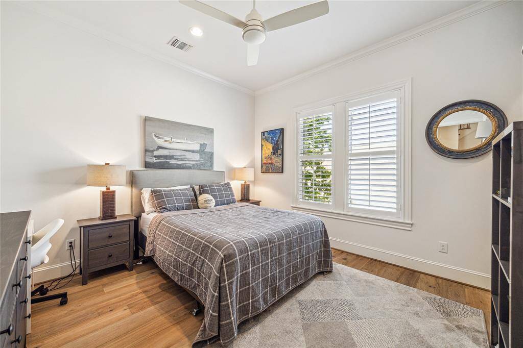 One of two secondary bedrooms on the second floor, both with ensuite baths.