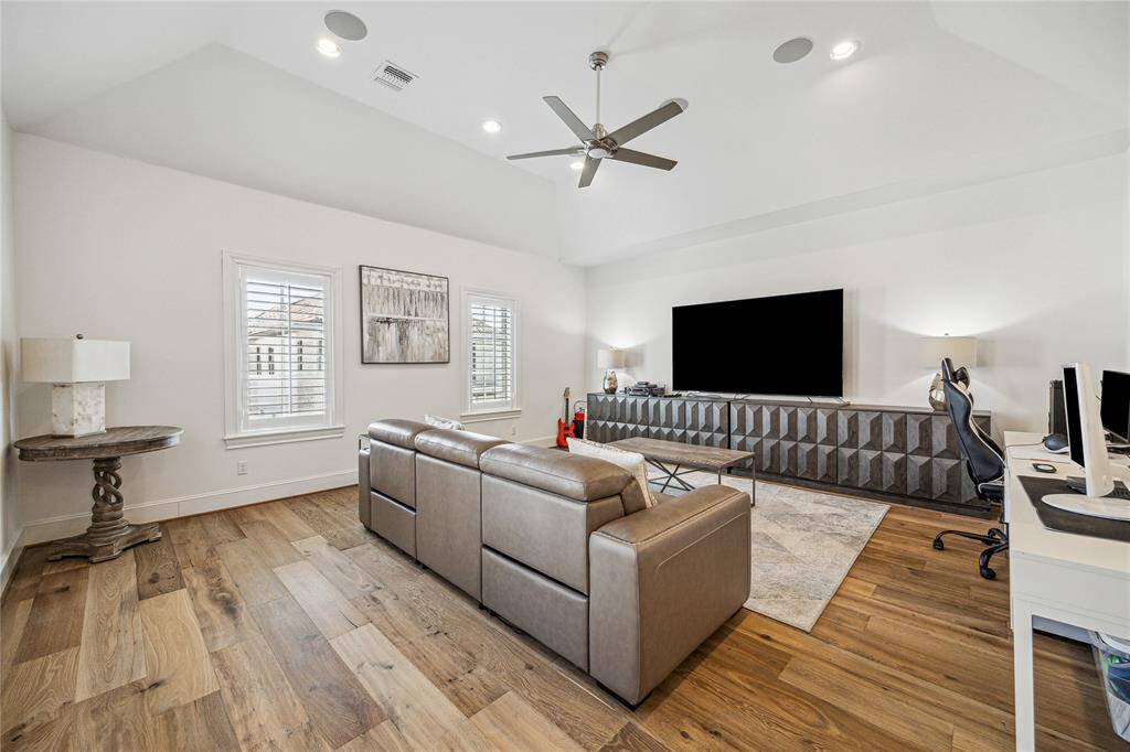 This third-floor game room has vaulted ceilings and is wired for sound.