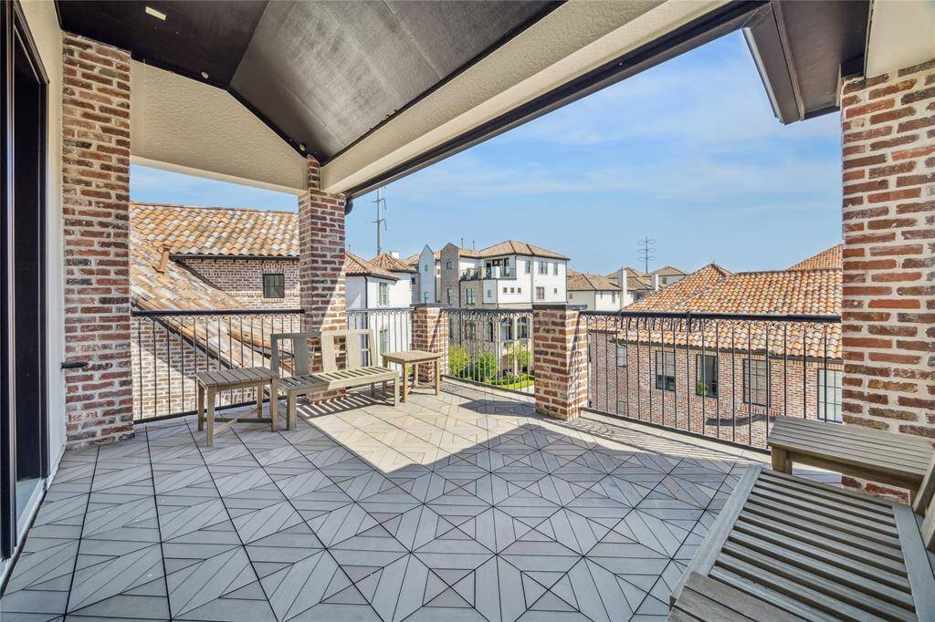 Game room leads to the partially covered roof deck, complete with gas, water, and electrical.