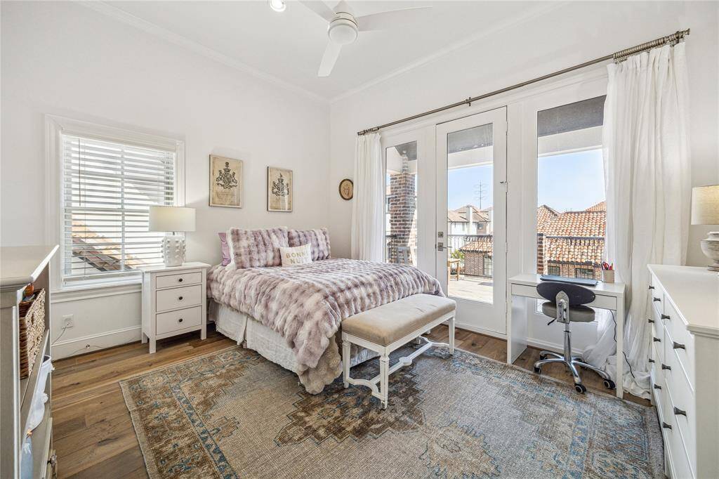 This secondary bedroom on the third floor opens out to the roof deck!