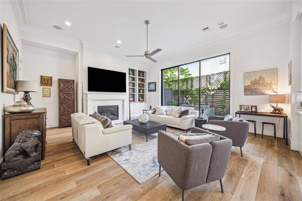 Five-piece crown moulding draws the eye up in the family room with soaring 12' ceilings.