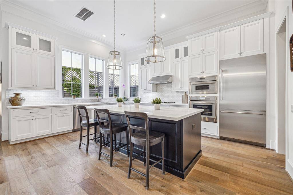 Back inside, the kitchen is outfitted with Thermador appliances.