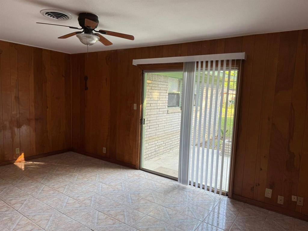 Sliding doors that lead to the backyard patio.