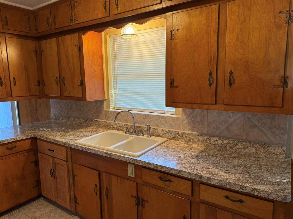 View of your kitchen sink and cabinets.