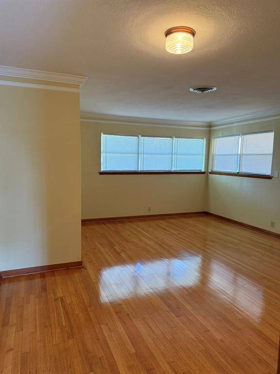 Look at that molding and those shiny hardwood floors!