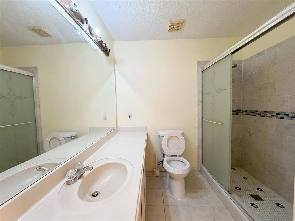 Primary bath with updated shower stall