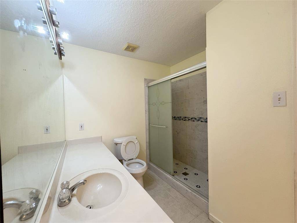 Primary bath with updated shower stall