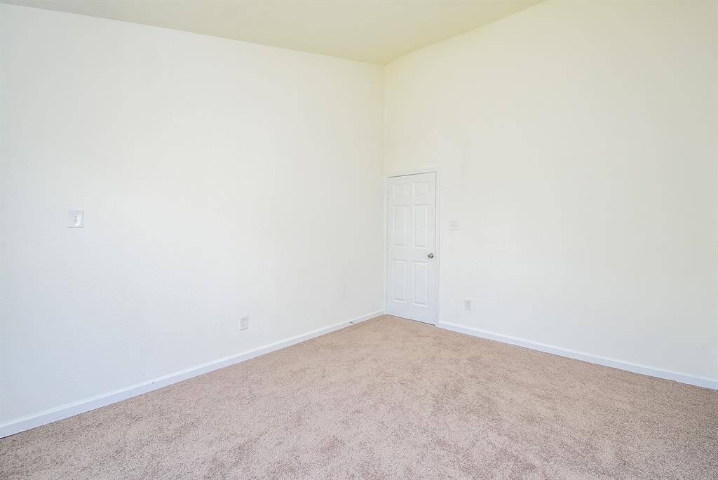 Spacious Laundry room with cabintry.