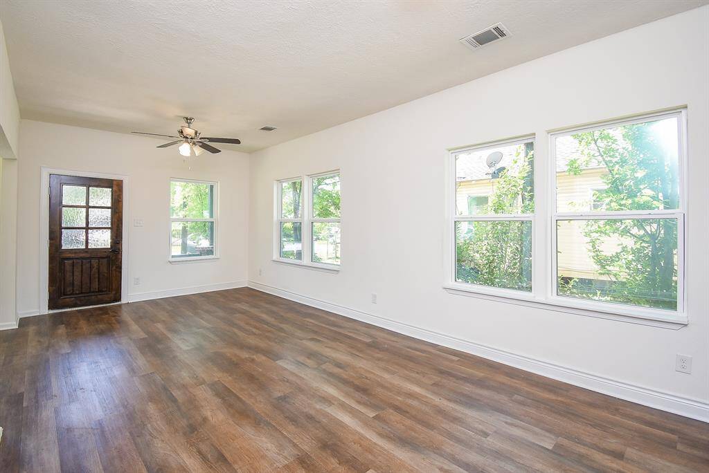 A view from the dining room and door to the full downstairs bath.