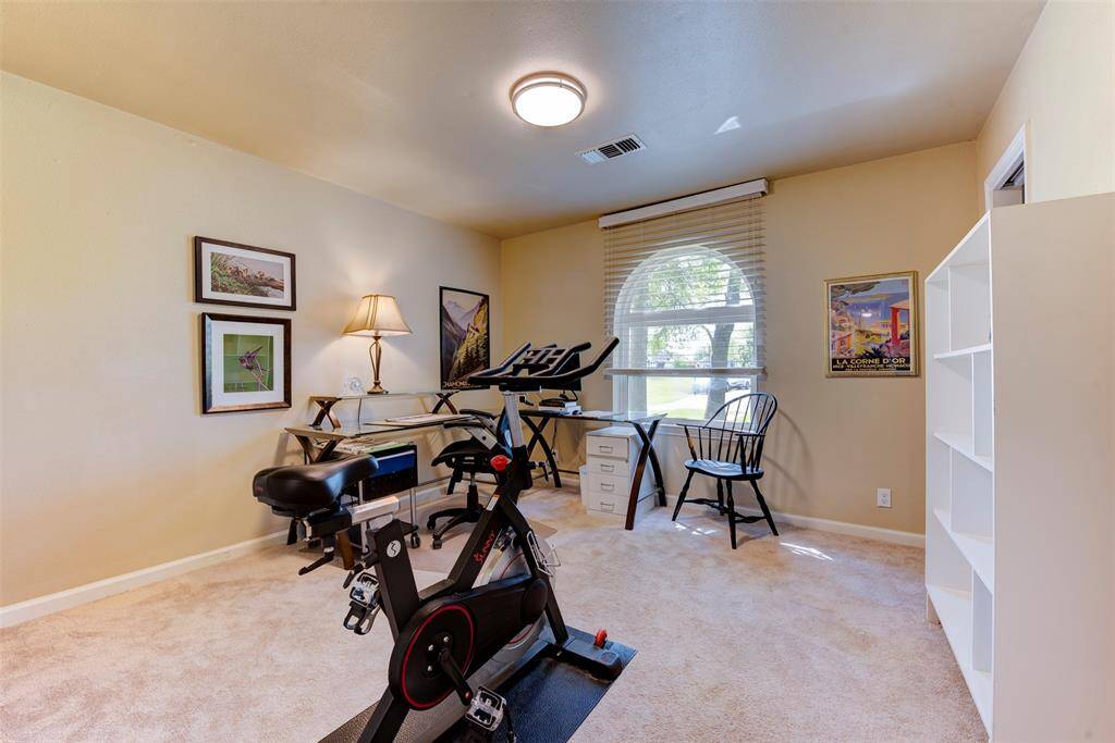 The arched front window adds character while bringing in plenty of natural light. (Book cases not attached)