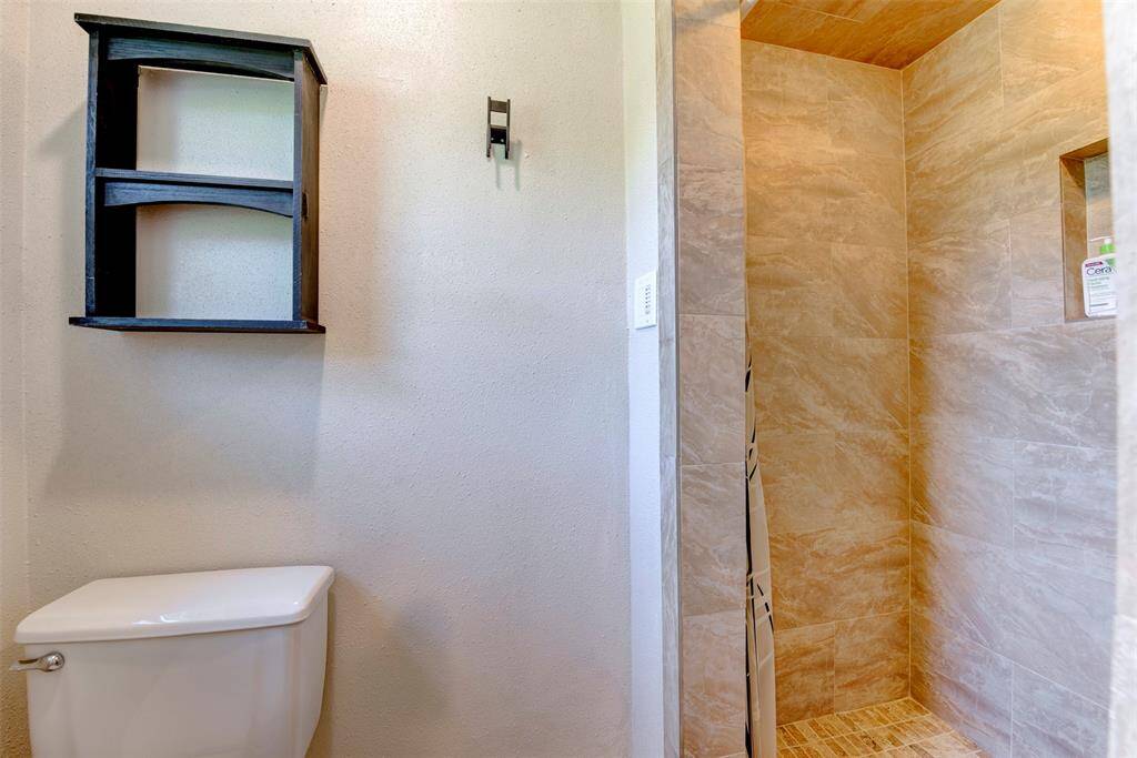 The primary bath features a large walk-in shower with tile surround-perfect for streamlined daily routines.