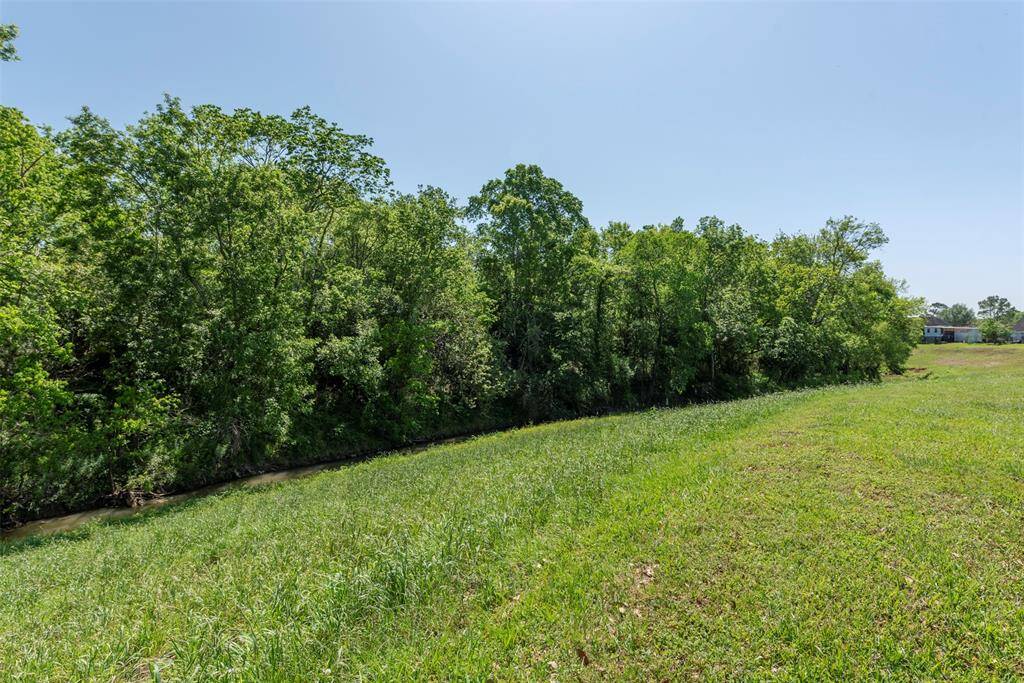 Enjoy your lovely view  from your charming patio or den. The creek water feature is the icing on the cake. Peaceful quiet living yet not far from medical center and major shopping areas.