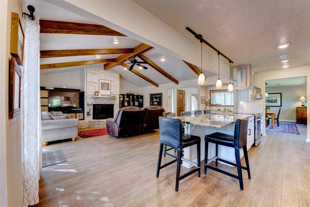 A large counter bar with seating for six adds both practicality and style to the open-concept space.