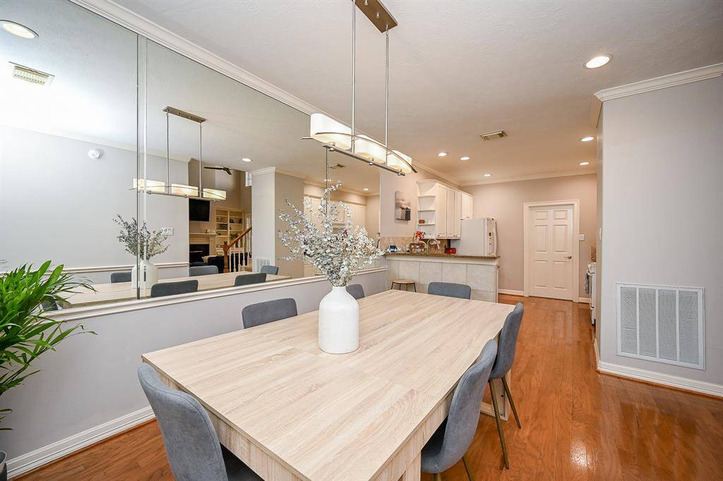The shining mirrored wall, left, adds more visual depth to an already ample area.