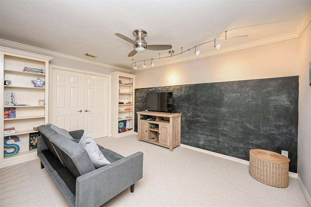 Create an entirely different, entertaining environment on this, the 2nd 'game room' floor, with fun gaming gear and/or make it a secondary private retreat. The floor-to-ceiling custom built-in shelving units welcome anything from favorite books to display trophies!
