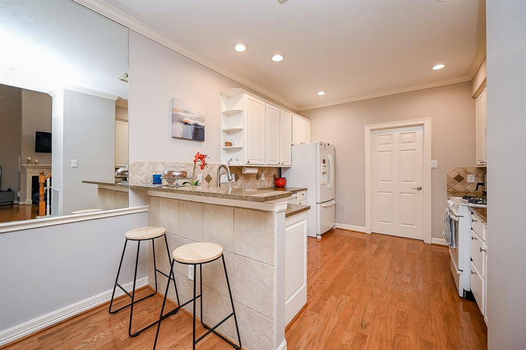 Wherever a high, extended kitchen counter is placed, there are comfy stools waiting to fill it, below!