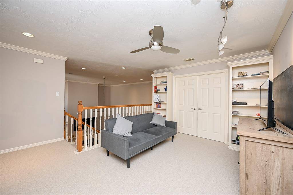 Here we are on the lush 2nd floor landing, with an open view of sturdy built-in storage units.