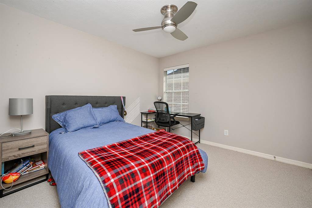 A big corner window in this secondary bedroom, means more wall space for accents!