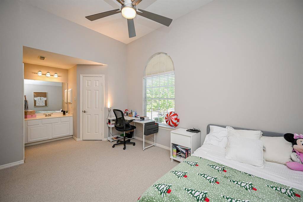 What an absolutely fanciful additional bedroom for family and guests, alike, with great floor and wall space, charming arched window, and easily accessed sink/vanity, left.