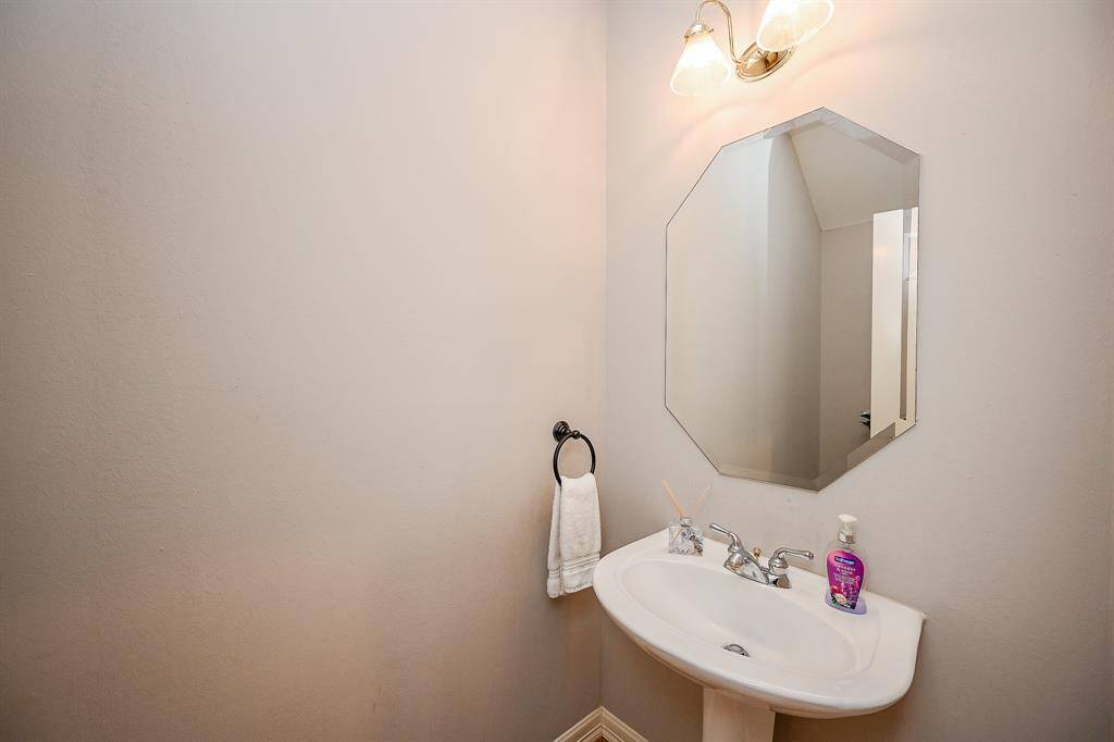 This charming powder room on the 1st floor offers its own quiet charm.