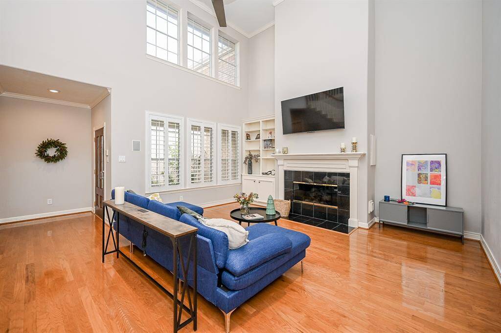 Wow! Expect admiring comments from guests when they enter this spectacular living/family room, just off the main entrance. An open/contemporary vibe embraces this stunning space; with high, vaulted ceiling; walls of windows, top and bottom, shining floor, and the star of the show: the elegant gas connected fireplace!