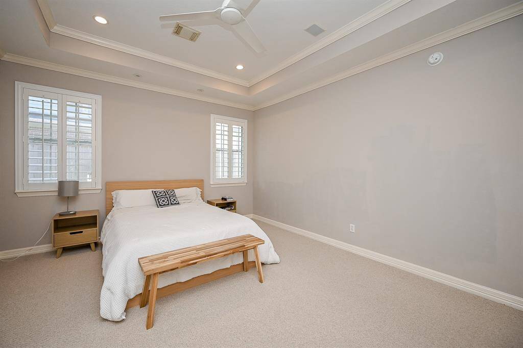 Keep it simple or create reading or hobby nooks in this huge, bright, carpeted primary suite.