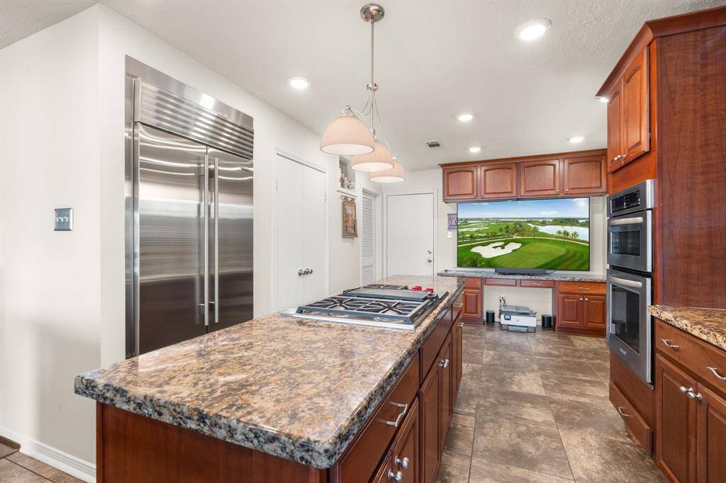 This dream kitchen also features a Sub Zero fridge.