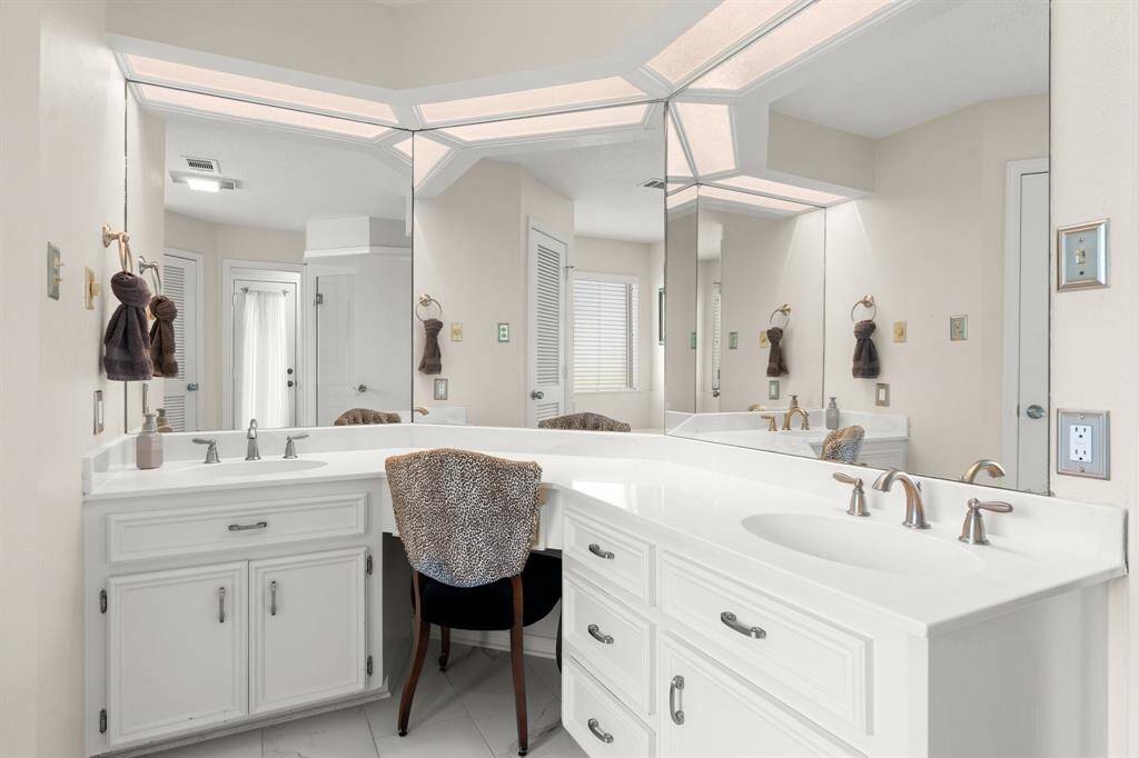 Dual sinks with vanity area.