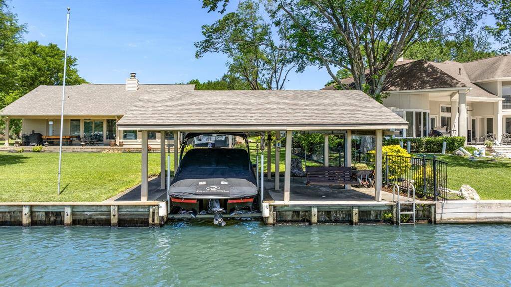 Covered boat slip with large deck.
