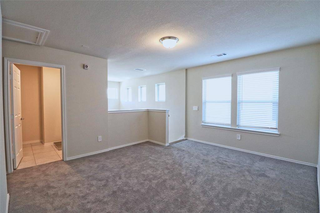 Versatile upstairs space perfect for a game room or study.