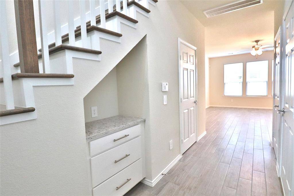 entry hallway features a built-in cabinet
