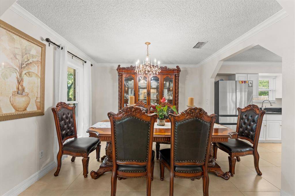 Make memories gathered around the table with your family and friends! This dinning room features nice fixtures and window facing the front.