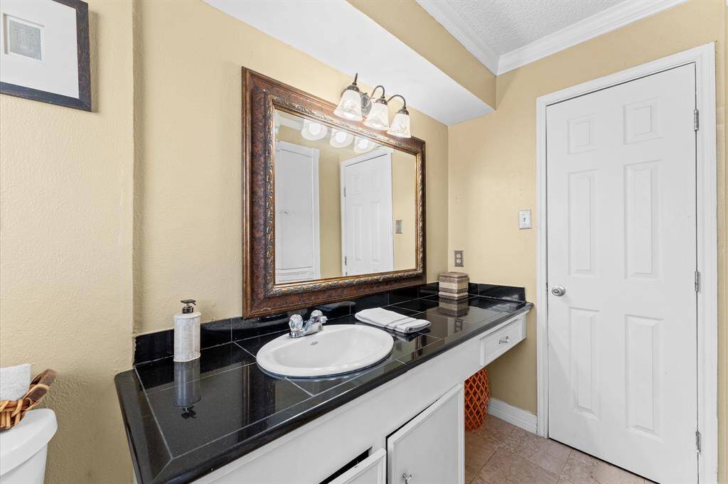 Bathroom features a single sink vanity
